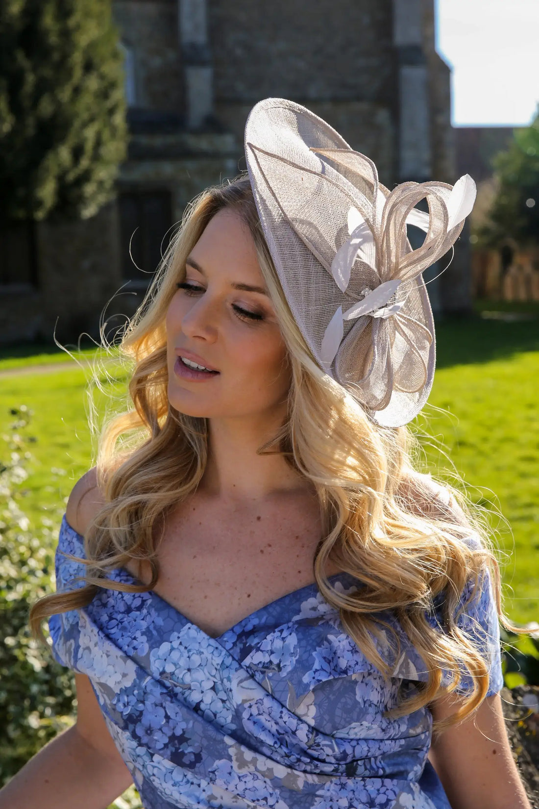 Woman wearing a silver fascinator