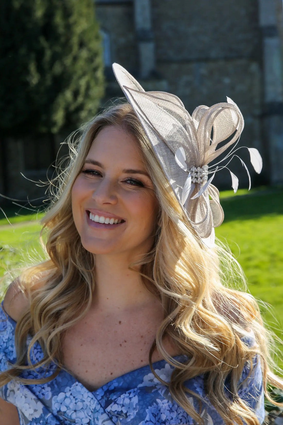 Woman wearing a silver fascinator