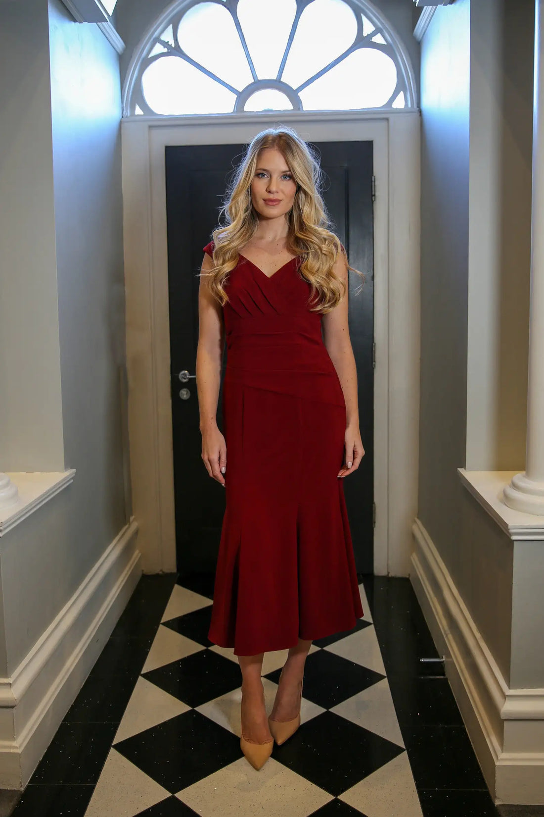 Woman wearing a Ruby Moss Crepe dress.