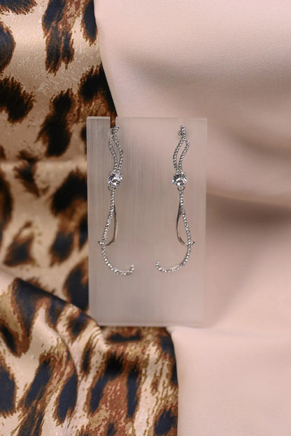 Silver long curved earrings with sparkle crystals.