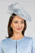 Woman wearing a light blue fascinator