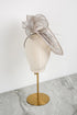Silver fascinator on a mannequin head against a white background