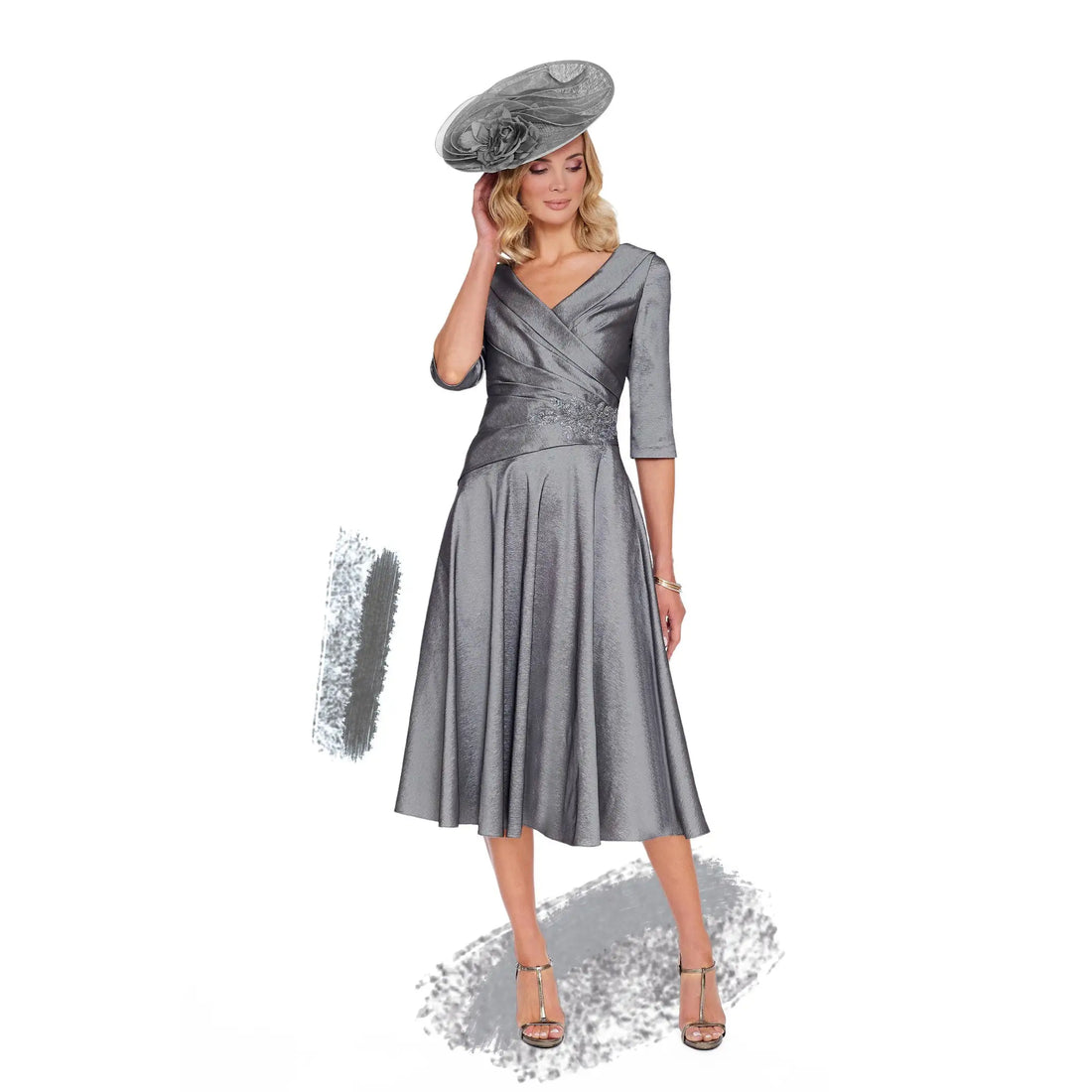 Woman wearing a silver dress with a matching hat on a white background