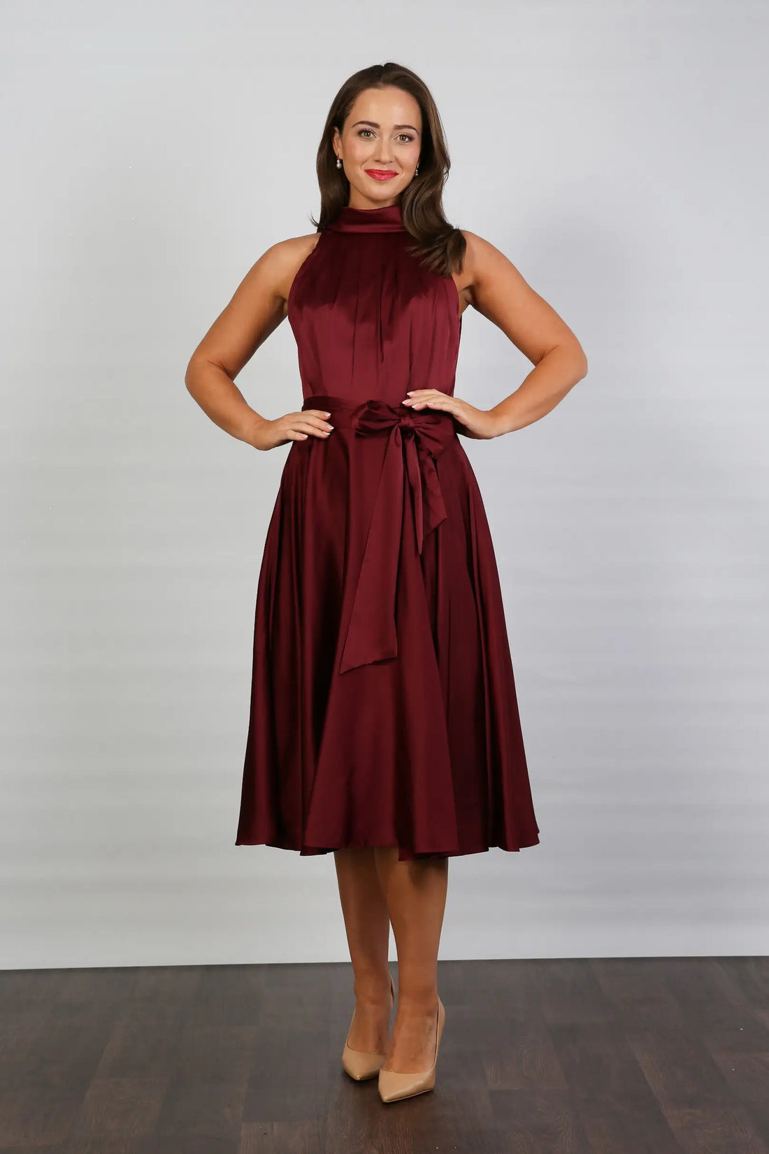 Woman in ruby silk occasion dress