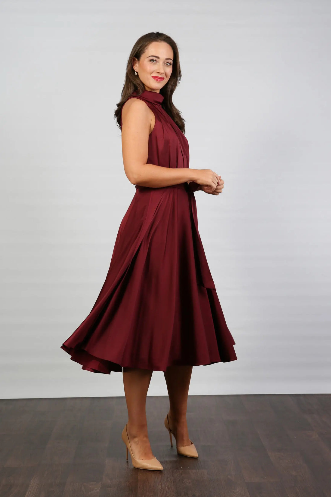 Woman in ruby silk occasion dress