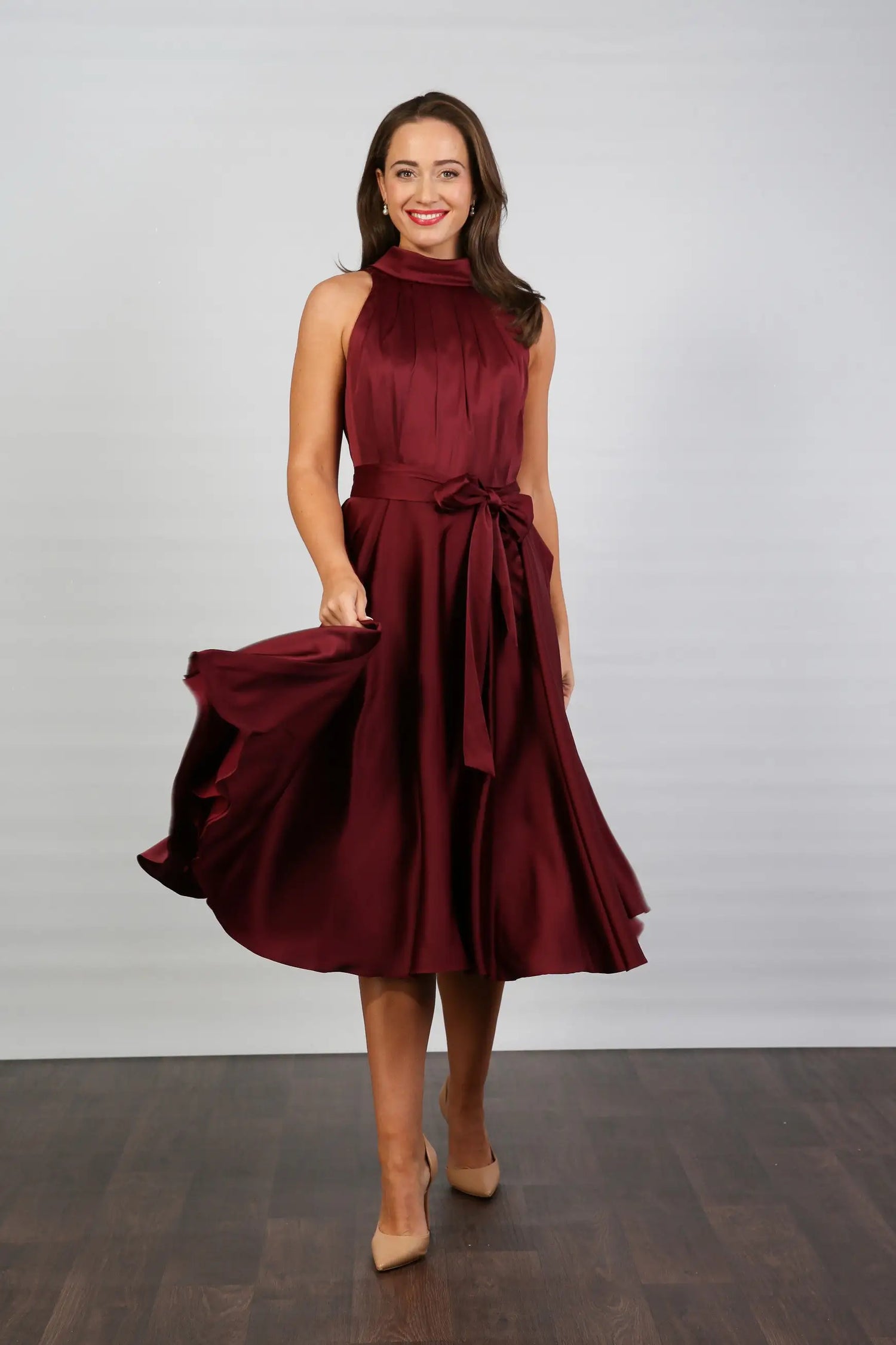 Woman in ruby silk occasion dress