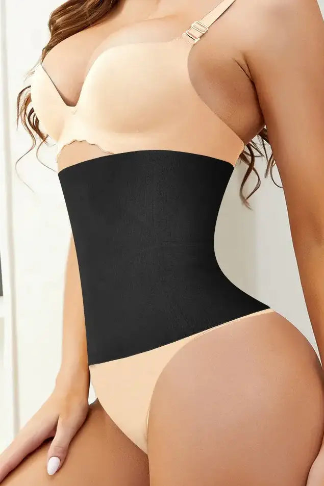 A close-up image of a person wearing a black waist smoother shapewear, focusing on the waist area showing the smoothing effect.