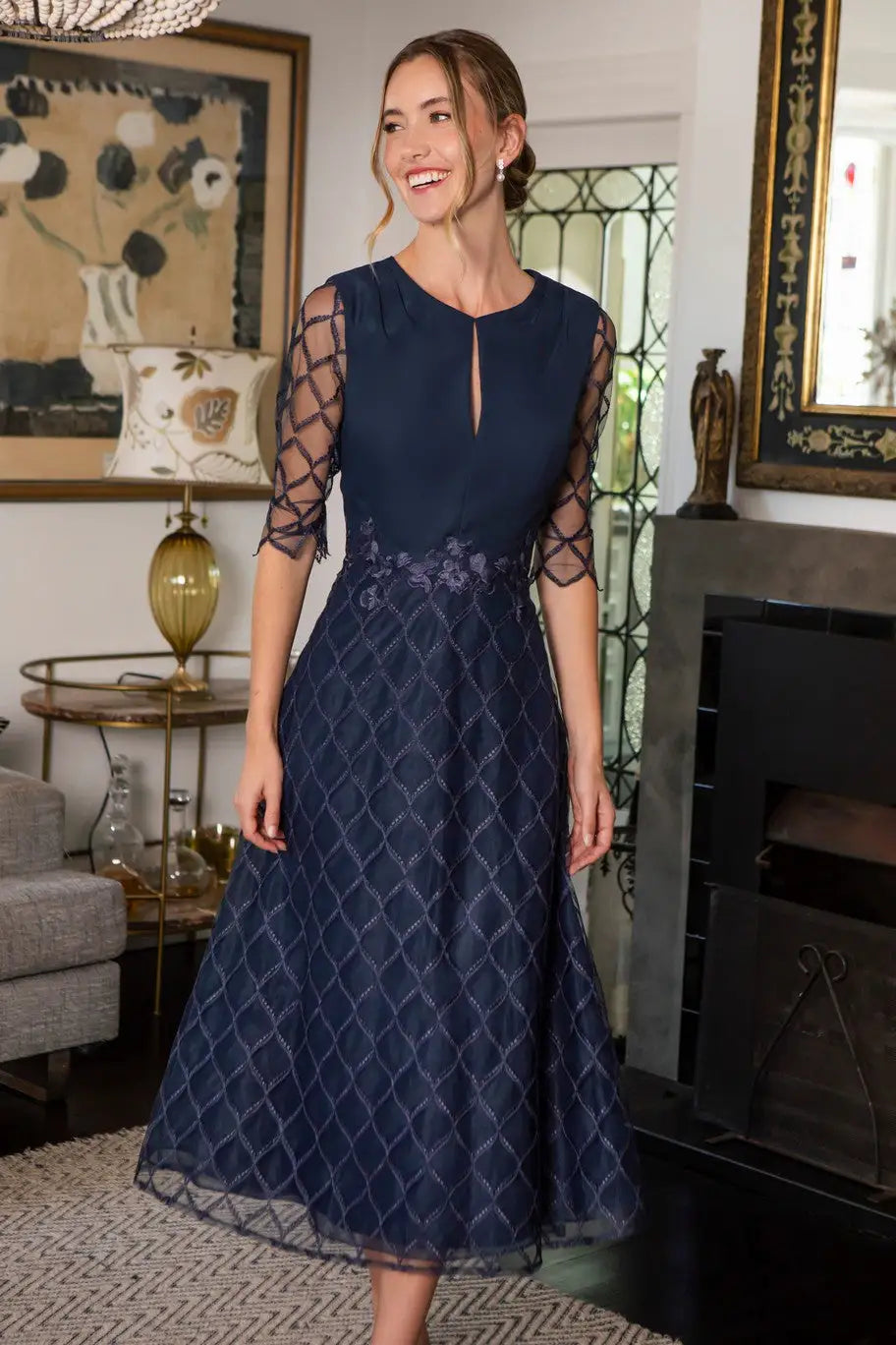 Woman in navy midi occasion dress